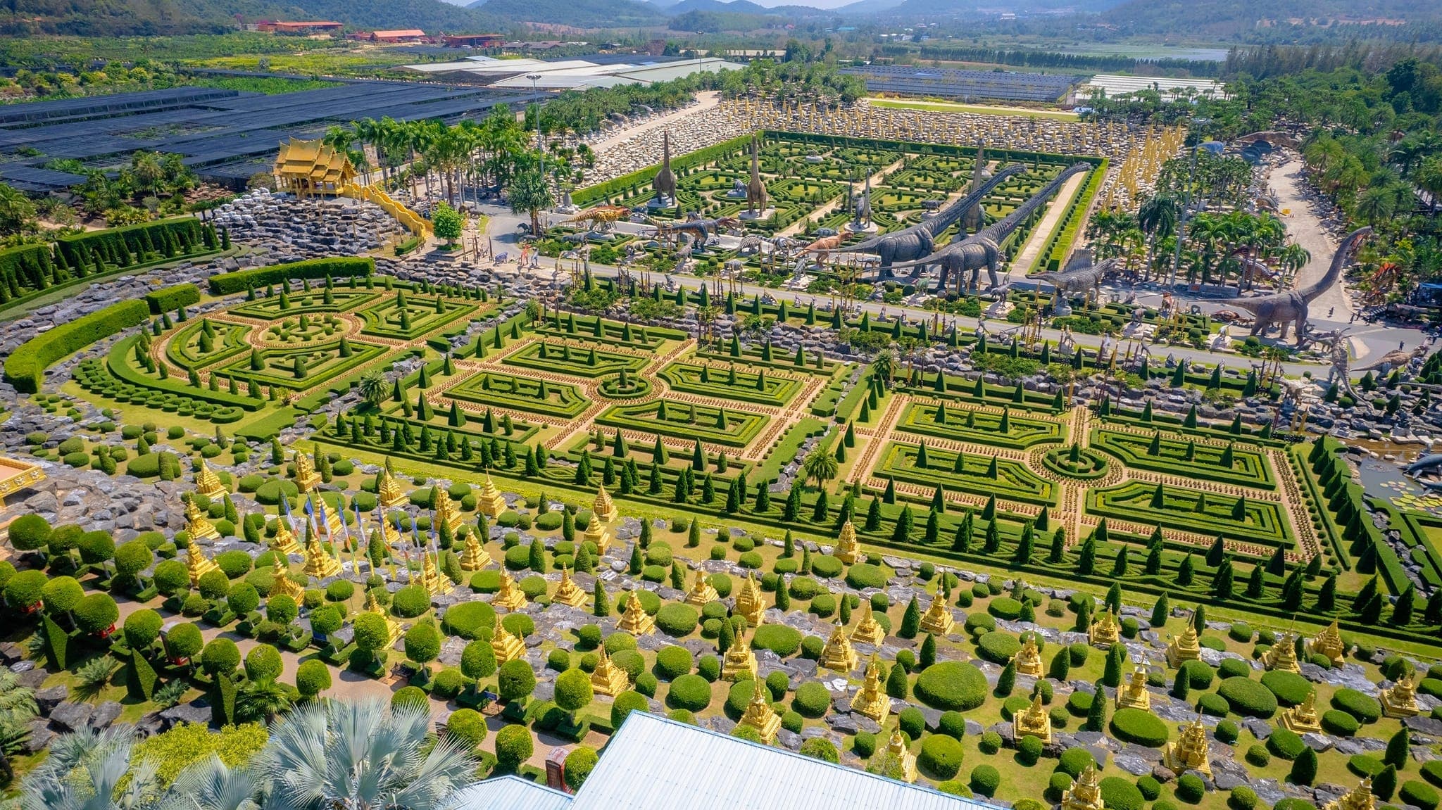 Nong Nooch Tropical Botanical Garden Pattaya — French formal garden with symmetrical topiary hedgerows and flower beds