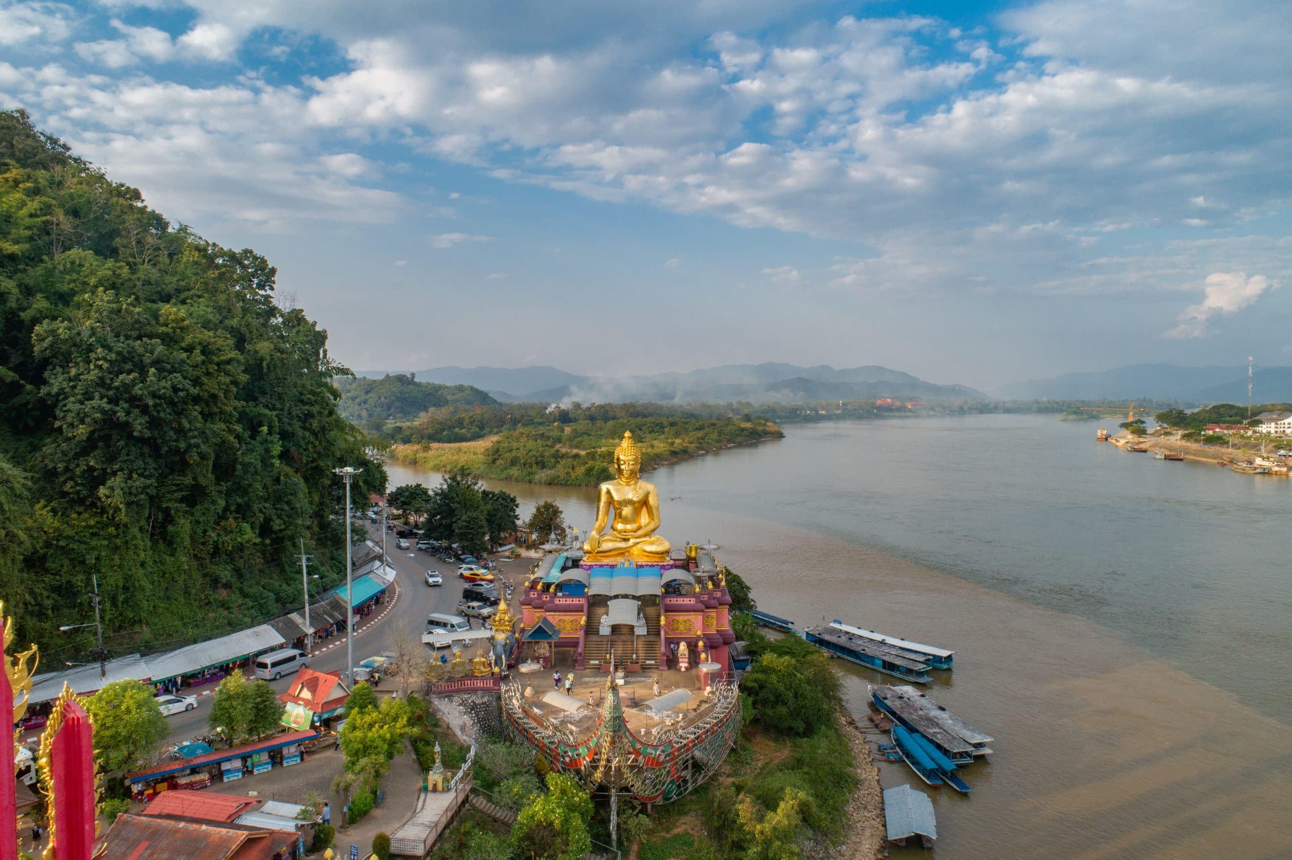 Golden Triangle Sop Ruak Chiang Rai — confluence of Mekong and Ruak rivers where Thailand Laos and Myanmar meet at sunset