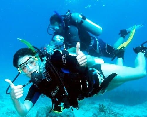 Scuba diver on a Pattaya try dive over the coral reef at the near islands
