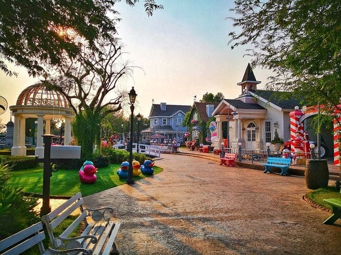 Chocolate Ville Bangkok cobbled European streetscape — pastel buildings and arched windows in Khan Na Yao district