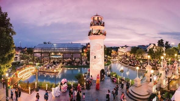 Chocolate Ville Bangkok lighthouse square at dusk — daily snow show location with European-style architecture