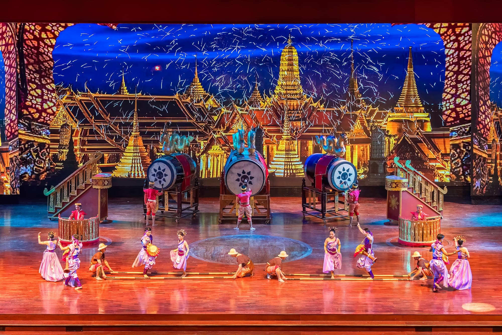 Nong Nooch Pattaya Thai cultural show — traditional dancers in costume, Muay Thai and sword fighting on stage