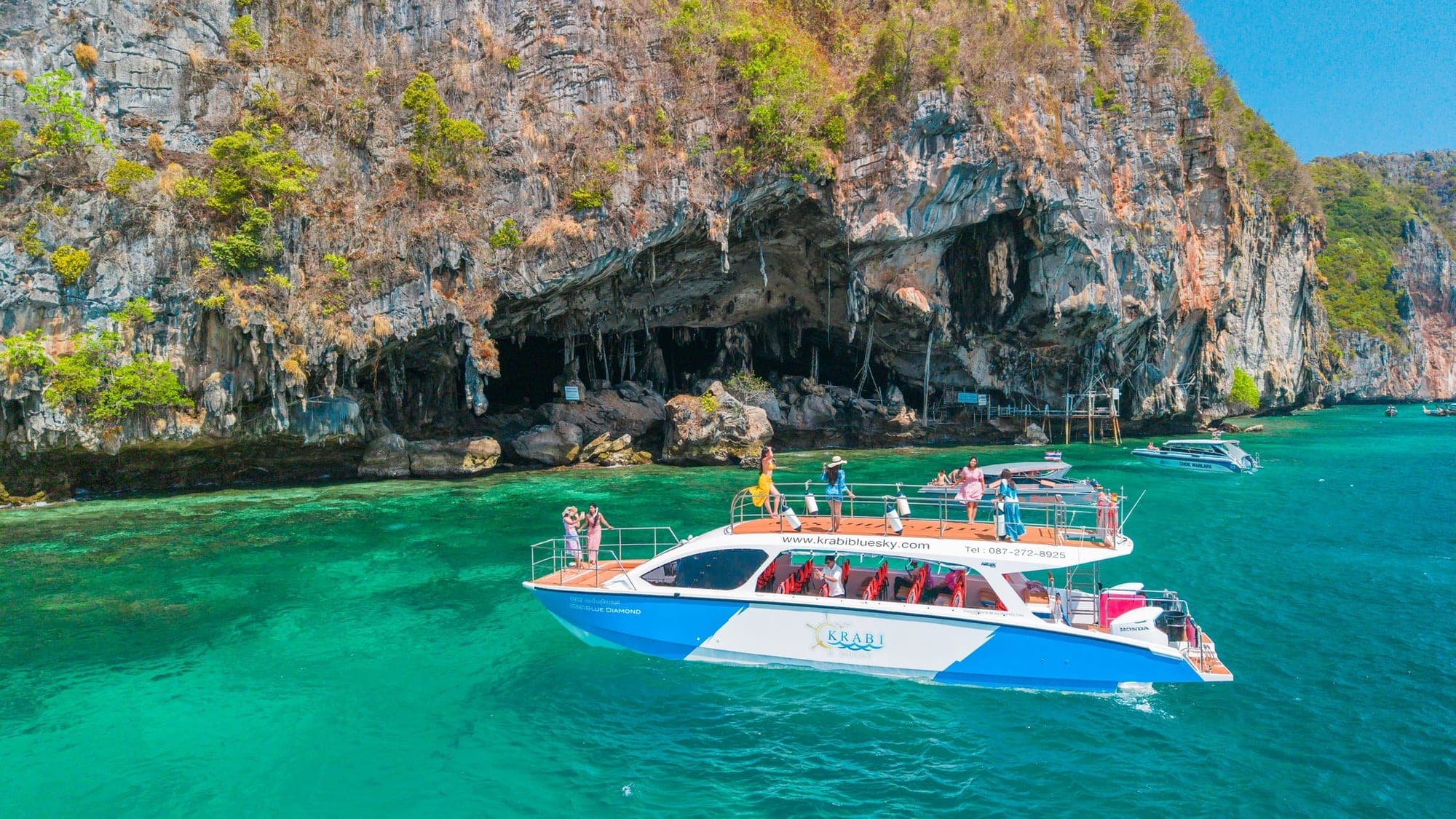 Covered shaded deck interior on Phi Phi catamaran from Krabi — seating, shade and shelter from spray