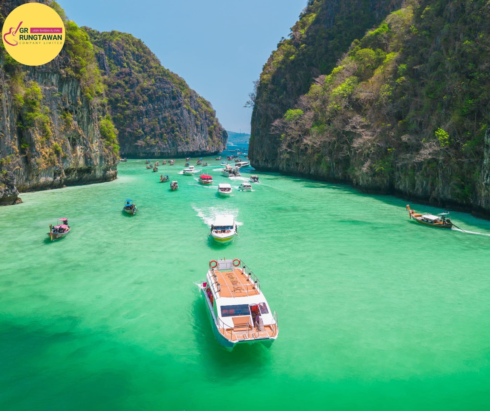 Maya Bay boardwalk approach from Loh Samah Bay — catamaran anchors and guests walk in via boardwalk, no swimming since 2022