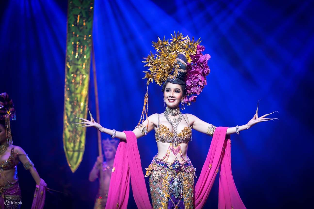 Alcazar Pattaya cabaret performer in elaborate feathered headdress and beaded costume