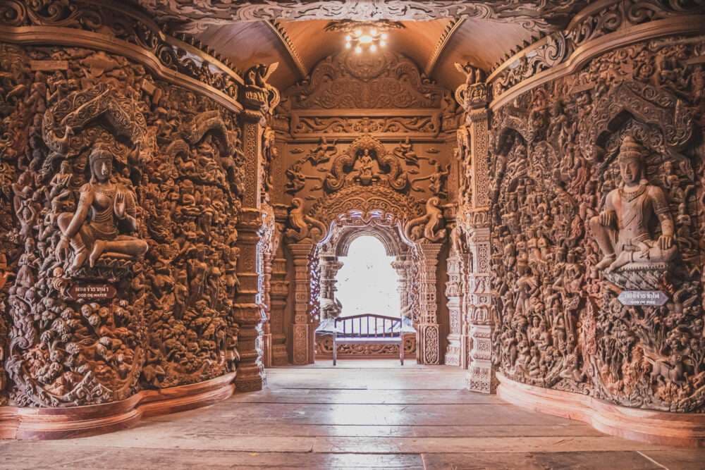 Sanctuary of Truth Pattaya interior — hand-carved teak panels with Hindu and Buddhist cosmology