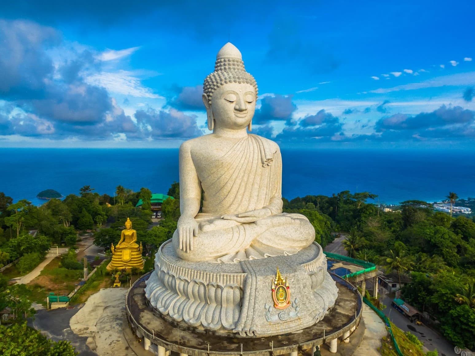 The Big Buddha of Phuket on Nakkerd Hill — 45 metres of white marble at 400 metres altitude, reopened 3 March 2026, free entry daily 09:00–18:00, the first stop of the Trip Thai Tour private afternoon-to-night day