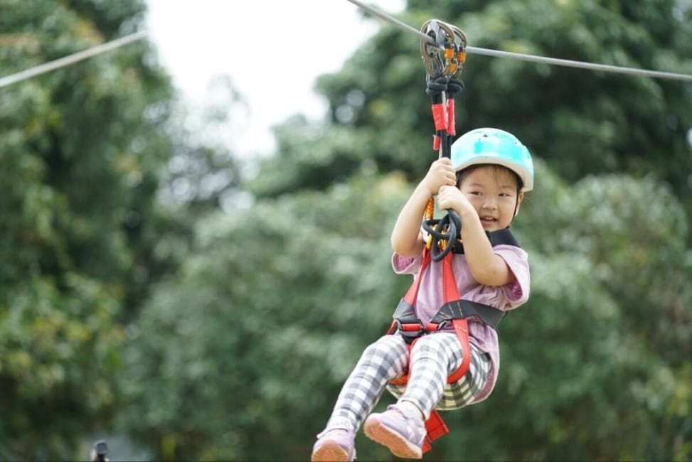 Child on the 7-platform kids course at Tarzan Adventure Pattaya
