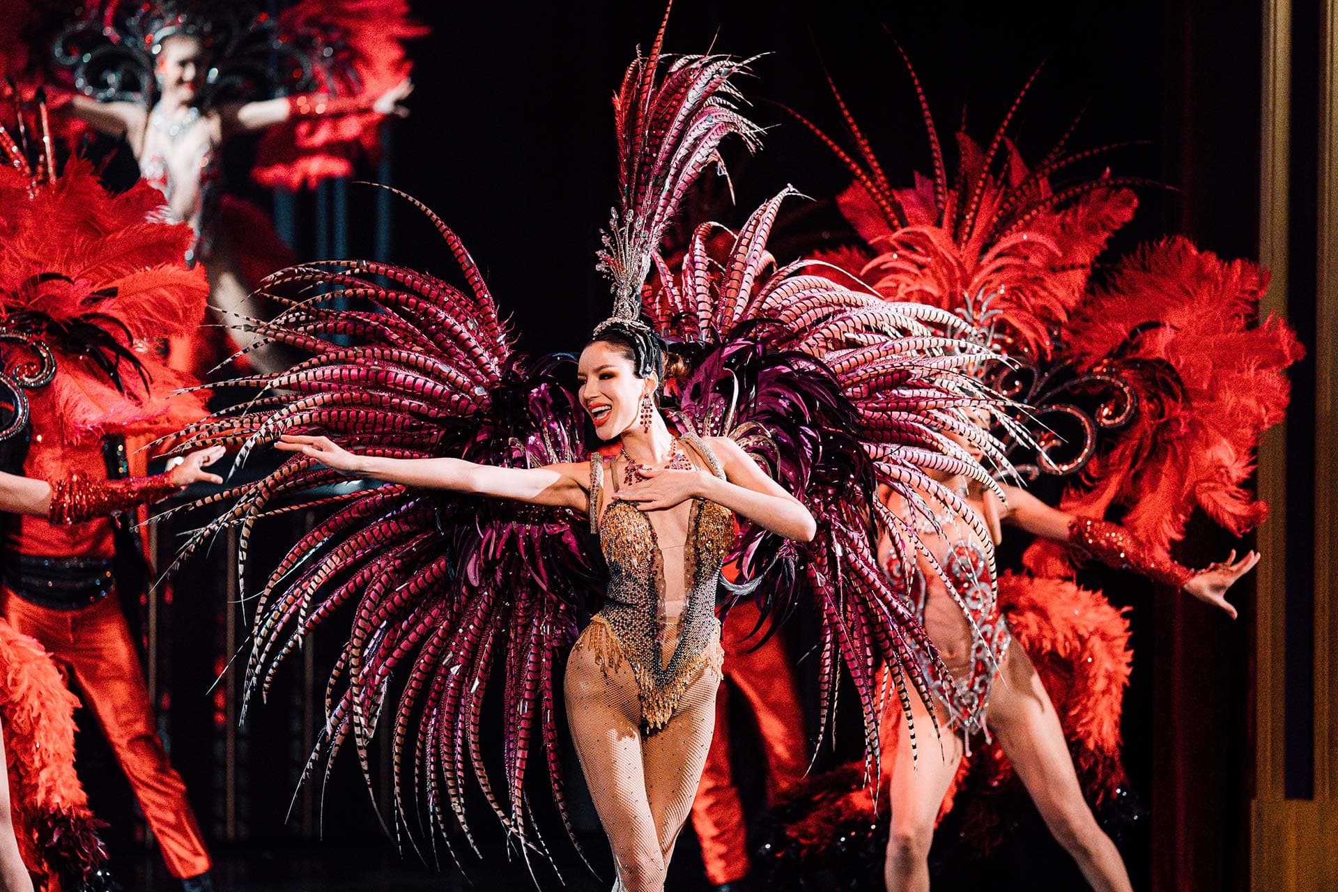 Simon Cabaret Phuket stage show with feathered costumes and lighting in Patong