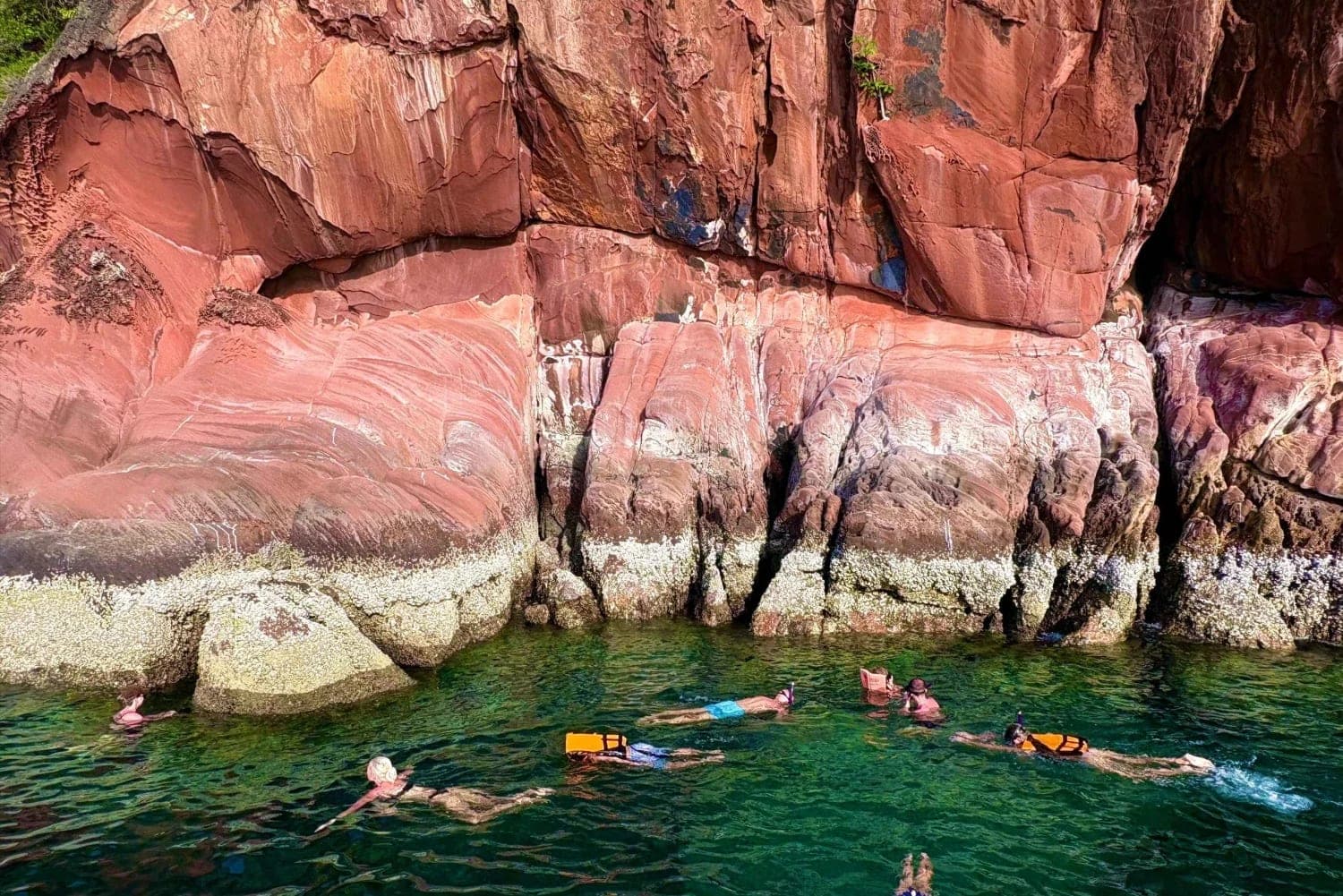 Daeng Island red limestone — small island with corals and snorkelling on Hong Islands tour