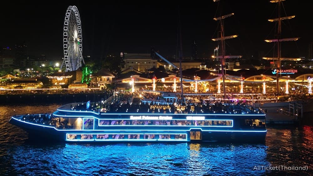Royal Princess Cruise blue LED-lit ship on the Chao Phraya River at Asiatique Bangkok at night