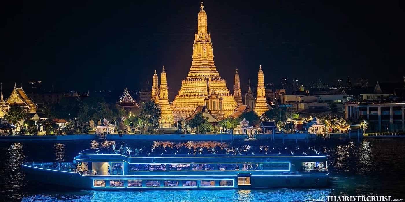 Wat Arun Temple of Dawn illuminated at night viewed from the Royal Princess Cruise Bangkok