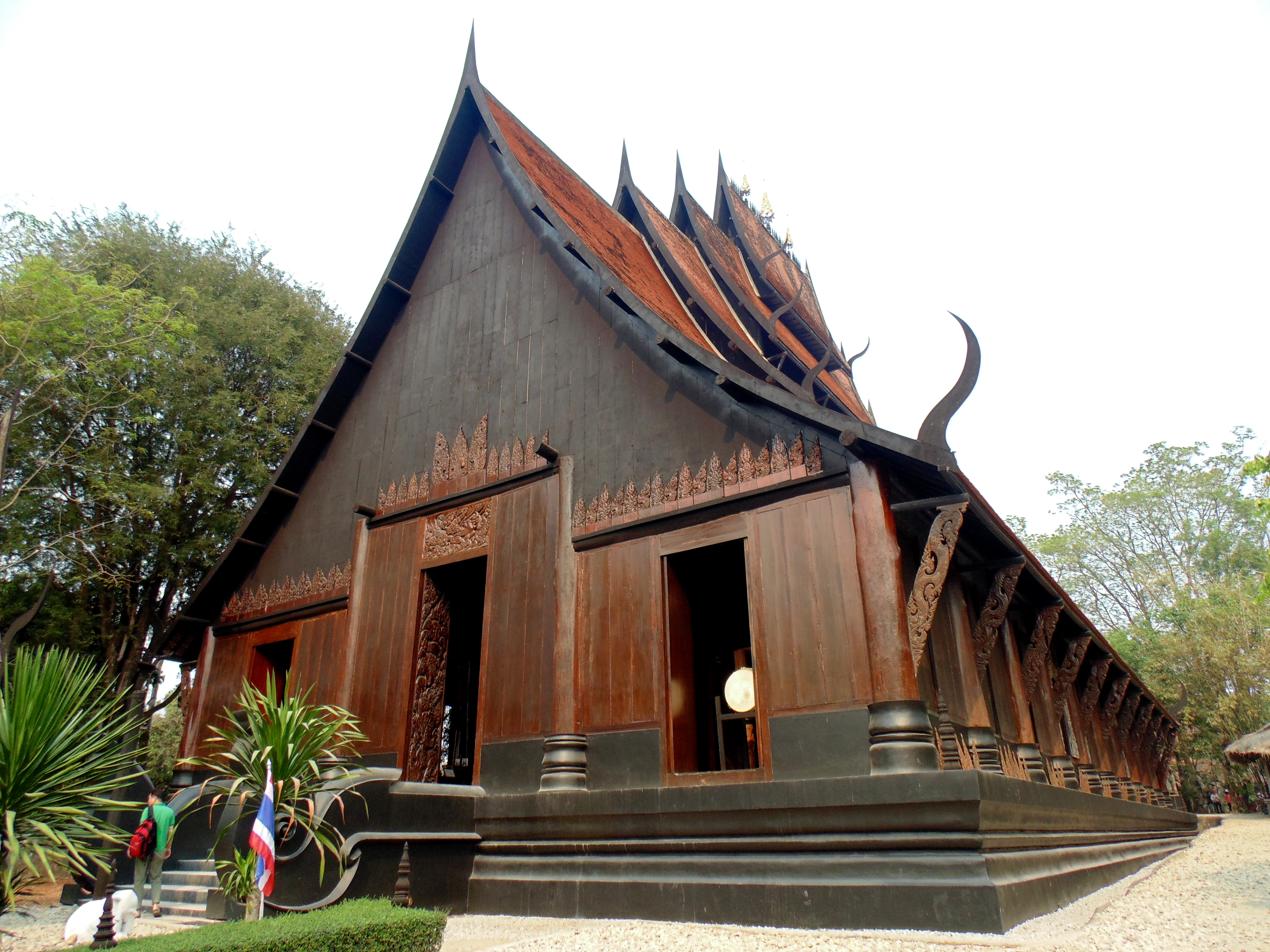 Baan Dam Black House Museum Chiang Rai — dark wooden buildings filled with animal skulls bones and dark sculptures by Thai National Artist Thawan Duchanee