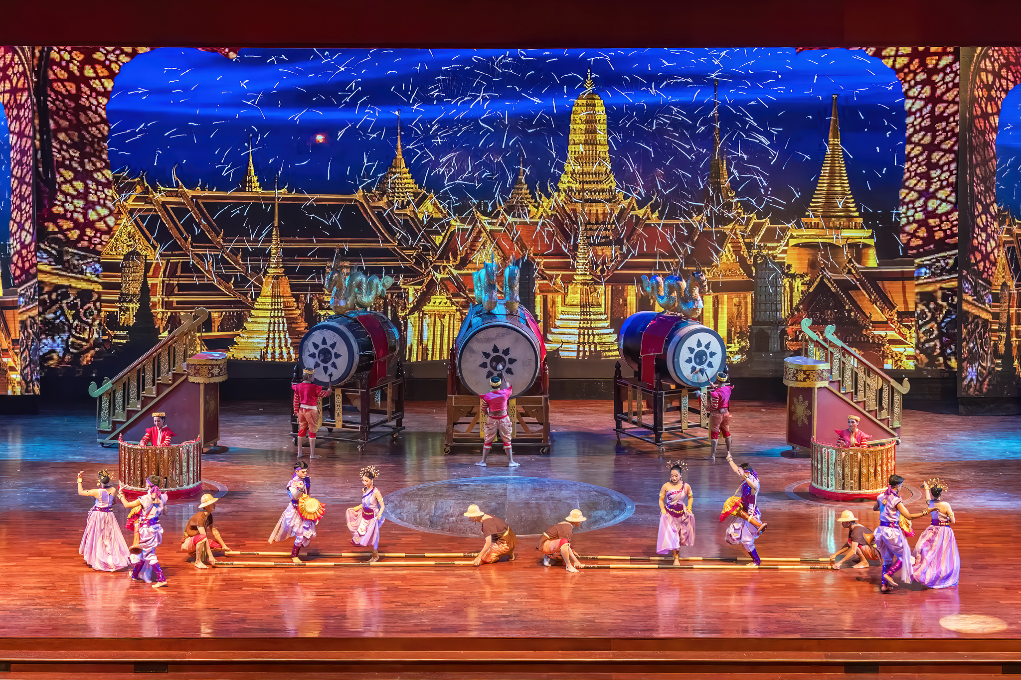 Nong Nooch Pattaya Thai cultural show — traditional dancers in costume, Muay Thai and sword fighting on stage